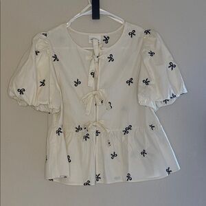 New’m - small- Tie-Front Peplum Blouse with Black Bow Embroidery - Cream